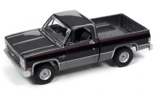 Chevrolet Silverado 1/64 Auto World R10 Fleetside metallise gris/negro 1987 coche miniatura