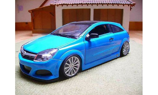 Opel Astra GTC 1/18 Welly opc coche miniatura